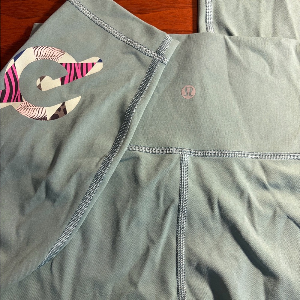lululemon athletica Light Sage Green Leggings with Pink Logo Detail
